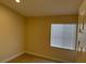 Bedroom with neutral colored walls, tiled flooring, and natural light at 3641 Spring Day Ct, Las Vegas, NV 89147