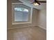 Serene bedroom with a large window and tile flooring bathed in natural light at 3641 Spring Day Ct, Las Vegas, NV 89147