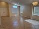 Spacious dining room with natural light, neutral walls, and tile flooring at 3641 Spring Day Ct, Las Vegas, NV 89147
