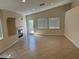 Bright and airy living room featuring a cozy fireplace and lots of natural light at 3641 Spring Day Ct, Las Vegas, NV 89147