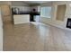 Open living area with neutral tile flooring, gas fireplace, and plenty of natural light at 3641 Spring Day Ct, Las Vegas, NV 89147