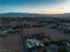 Dramatic aerial view of the home with the Las Vegas skyline in the distance at 4061 W Eldorado Ln, Las Vegas, NV 89139