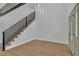 Inviting foyer with modern staircase, hardwood floors, and contemporary lighting at 4061 W Eldorado Ln, Las Vegas, NV 89139