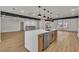 Modern kitchen with a large island perfect for entertaining and stainless steel dishwasher at 4061 W Eldorado Ln, Las Vegas, NV 89139