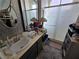 Functional bathroom featuring a vanity with a sink, mirrored wall, and a glass-enclosed shower at 415 Golden State St, Henderson, NV 89012