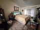 Cozy bedroom with natural light, plush carpeting, and a neutral color scheme creating a serene and relaxing space at 415 Golden State St, Henderson, NV 89012
