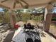 Inviting covered patio area with seating, perfect for enjoying the outdoor space and garden views at 415 Golden State St, Henderson, NV 89012