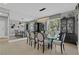 Elegant dining room with a glass table, stylish chairs, and decorative lighting at 4430 Angelo Rosa St, Las Vegas, NV 89135