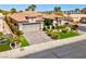Charming single-story home with a manicured lawn, paver driveway, and a two-car garage at 4430 Angelo Rosa St, Las Vegas, NV 89135