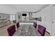 Gourmet kitchen with granite counters and an island featuring seating for four at 4430 Angelo Rosa St, Las Vegas, NV 89135