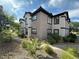 Condominium exterior view with landscaping, walkways, and well-maintained architecture at 45 Maleena Mesa St # 1321, Henderson, NV 89074