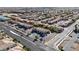 Overhead shot showcasing neighborhood homes near commercial shops, landscaped streets and organized parking at 5438 Jacobs Field St, Las Vegas, NV 89148