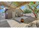 Cozy backyard patio features a wooden pergola, desert landscaping, perfect for outdoor lounging and BBQs at 5438 Jacobs Field St, Las Vegas, NV 89148