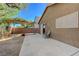 Inviting backyard patio with a wooden pergola, concrete pad, perfect for outdoor relaxation and entertaining at 5438 Jacobs Field St, Las Vegas, NV 89148