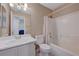 Bright bathroom features a single sink vanity with white cabinets and a shower-tub combo at 5438 Jacobs Field St, Las Vegas, NV 89148