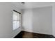 Bedroom featuring hardwood floors and a window with blinds at 5438 Jacobs Field St, Las Vegas, NV 89148
