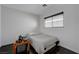 A cozy bedroom featuring natural light, a comfortable bed, and hardwood floors at 5438 Jacobs Field St, Las Vegas, NV 89148