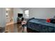Bedroom with hardwood floors, tv and desk area, and a connected bathroom at 5438 Jacobs Field St, Las Vegas, NV 89148