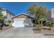 Charming single Gathering home with a well-maintained front yard and a two-car garage in a suburban neighborhood at 5438 Jacobs Field St, Las Vegas, NV 89148