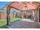 View of the backyard featuring a brick patio under a shaded gazebo with a grill at 5556 Cornadelo Range Rd, Las Vegas, NV 89113