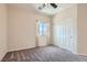 Cozy bedroom features a neutral color scheme, closet and a bright window at 5556 Cornadelo Range Rd, Las Vegas, NV 89113