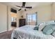 Comfortable bedroom boasts plush pillows, soft bedding, and a bright window at 5556 Cornadelo Range Rd, Las Vegas, NV 89113
