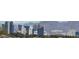 Expansive cityscape view showcasing modern architecture against a backdrop of picturesque mountains at 5556 Cornadelo Range Rd, Las Vegas, NV 89113