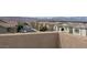 Elevated view showing residential homes in a suburban community with mountain views at 5556 Cornadelo Range Rd, Las Vegas, NV 89113