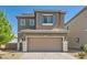 Charming two-story home with a spacious two-car garage and low maintenance desert landscaping at 5556 Cornadelo Range Rd, Las Vegas, NV 89113