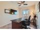 Bright home office with a desk, desk chair, and large windows at 5556 Cornadelo Range Rd, Las Vegas, NV 89113
