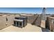 Comfortable rooftop deck with a dining set, overhead lights, and a sleek patio heater at 5556 Cornadelo Range Rd, Las Vegas, NV 89113