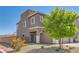 View of the side exterior showcasing the desert landscaping and proximity to the street at 5556 Cornadelo Range Rd, Las Vegas, NV 89113