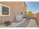 Cozy side yard featuring low-maintenance gravel landscaping, a small bridge, and stucco walls at 5556 Cornadelo Range Rd, Las Vegas, NV 89113