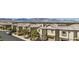 A suburban streetscape view showing well-maintained homes in a Gathering-friendly community at 5556 Cornadelo Range Rd, Las Vegas, NV 89113