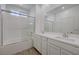 Bathroom features a soaking tub and shower combination alongside a double sink vanity at 5730 Sky Pointe Dr # 104, Las Vegas, NV 89130