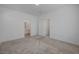 Bedroom with carpeting and access to a bathroom through a door at 5730 Sky Pointe Dr # 104, Las Vegas, NV 89130