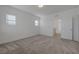 Bedroom with carpeting, white walls, and entrance to hallway at 5730 Sky Pointe Dr # 104, Las Vegas, NV 89130