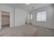 Bright bedroom with carpeting and natural light from the windows at 5730 Sky Pointe Dr # 104, Las Vegas, NV 89130