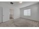 Bedroom with carpeting, white walls, and natural light from window at 5730 Sky Pointe Dr # 104, Las Vegas, NV 89130