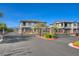 Gated community entrance with stone pillars and black iron gates, offering privacy and security at 5730 Sky Pointe Dr # 104, Las Vegas, NV 89130