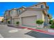 Row of garages at the townhome, complete with individual unit numbers and 'No Parking Fire Lane' signage at 5730 Sky Pointe Dr # 104, Las Vegas, NV 89130