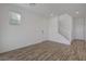 Cozy living room showcases wood-look flooring, a staircase, and plenty of natural light at 5730 Sky Pointe Dr # 104, Las Vegas, NV 89130