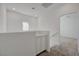 Bright loft area with built-in cabinets and access to bedrooms with plush carpeting at 5730 Sky Pointe Dr # 104, Las Vegas, NV 89130