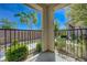 Covered patio featuring sleek metal railings and peaceful views of landscaped yard at 5730 Sky Pointe Dr # 104, Las Vegas, NV 89130