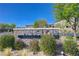 Attractive community entrance sign 'Winslow' adorned with stone and lush landscaping, set against a bright sky at 5730 Sky Pointe Dr # 104, Las Vegas, NV 89130
