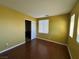 Cozy bedroom featuring wood-look floors, a window for natural light, and a convenient closet at 5846 Lee Fairy Ct, Las Vegas, NV 89139