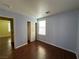 Bedroom featuring wood-look floors with an adjacent room and closet at 5846 Lee Fairy Ct, Las Vegas, NV 89139