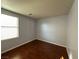 Bedroom featuring wood-look floors and a window, creating a serene atmosphere at 5846 Lee Fairy Ct, Las Vegas, NV 89139