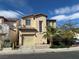 Charming two-story home featuring a tile roof, a single-car garage and a palm tree in the front yard at 5846 Lee Fairy Ct, Las Vegas, NV 89139