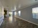 Spacious living room featuring tiled floors, decorative walls, recessed lighting, and sliding glass doors to the backyard at 5846 Lee Fairy Ct, Las Vegas, NV 89139